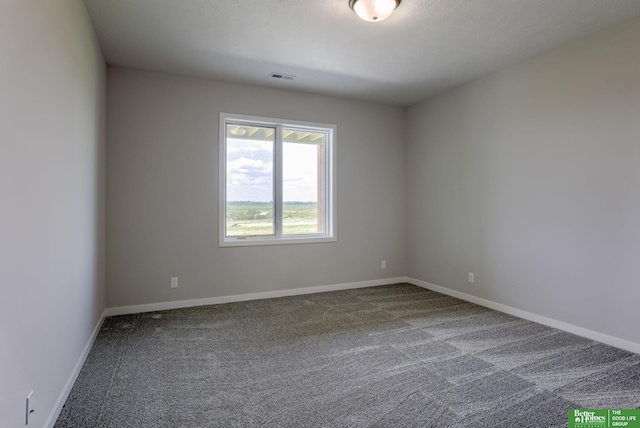 5620 N 212th St, Elkhorn, NE 68022 - spare room with dark carpet and baseboards