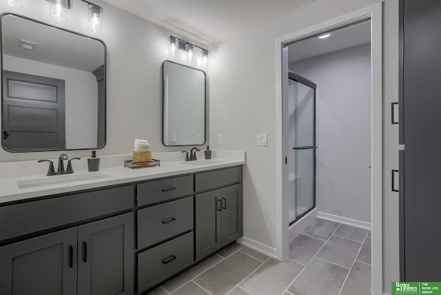 5620 N 212th St, Elkhorn, NE 68022 - bathroom featuring double vanity, a stall shower, and tile patterned flooring