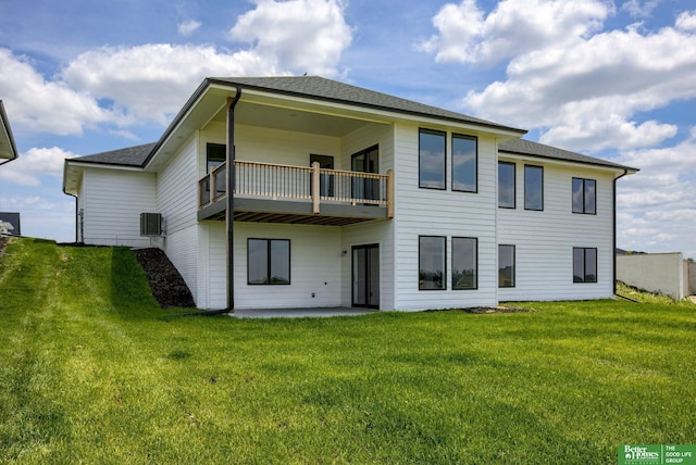 5620 N 212th St, Elkhorn, NE 68022 - rear view of property with a balcony, a lawn, a patio area, and a shingled roof