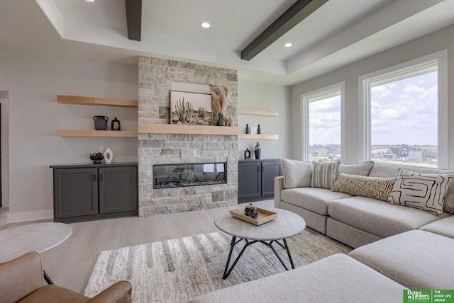 5620 N 212th St, Elkhorn, NE 68022 - living room with light wood finished floors, a stone fireplace, a tray ceiling, and recessed lighting