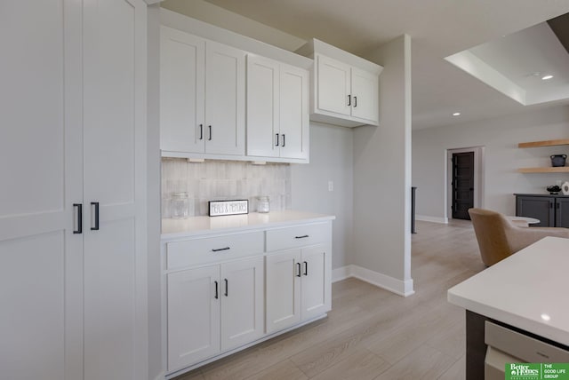 5602 N 212th St, Elkhorn, NE 68022 - kitchen featuring tasteful backsplash, light wood-style flooring, light countertops, white cabinetry, and recessed lighting