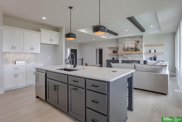 5602 N 212th St, Elkhorn, NE 68022 - kitchen with stainless steel dishwasher, white cabinets, light wood-style flooring, gray cabinets, and recessed lighting