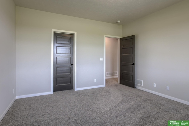 5602 N 212th St, Elkhorn, NE 68022 - unfurnished bedroom featuring carpet flooring