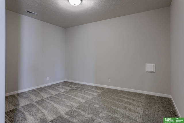 5602 N 212th St, Elkhorn, NE 68022 - empty room with carpet flooring and a textured ceiling