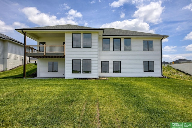 5602 N 212th St, Elkhorn, NE 68022 - rear view of property with a lawn and a balcony