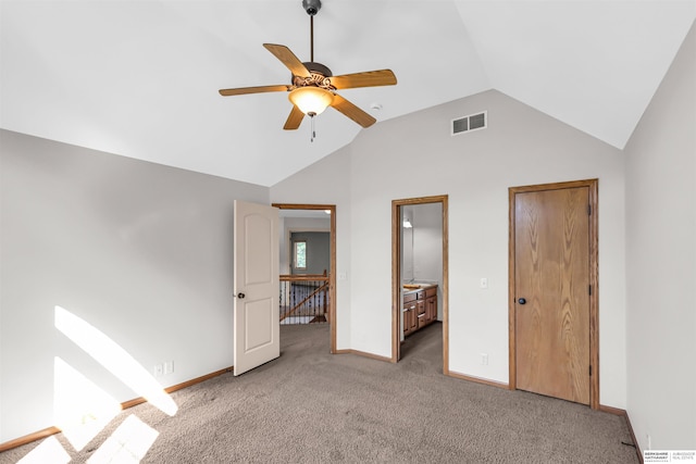 10149 Edward St, La Vista, NE 68128 - unfurnished bedroom featuring vaulted ceiling, carpet flooring, ensuite bath, and a ceiling fan