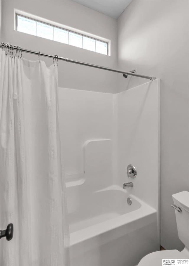 10149 Edward St, La Vista, NE 68128 - bathroom featuring toilet and shower / bath combination with curtain