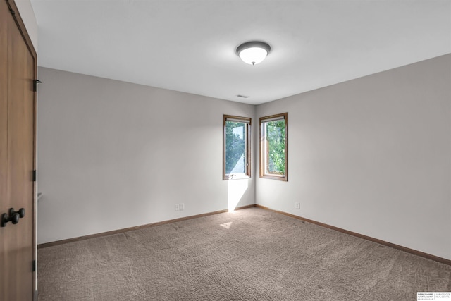 10149 Edward St, La Vista, NE 68128 - spare room featuring carpet and baseboards