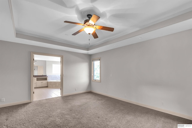 10149 Edward St, La Vista, NE 68128 - unfurnished room featuring a tray ceiling, carpet flooring, and a ceiling fan