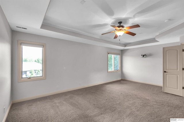 10149 Edward St, La Vista, NE 68128 - carpeted spare room with a raised ceiling and ceiling fan