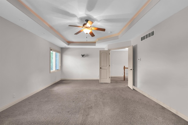 10149 Edward St, La Vista, NE 68128 - carpeted empty room featuring a tray ceiling and a ceiling fan