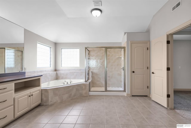 10149 Edward St, La Vista, NE 68128 - bathroom with tile patterned floors, a garden tub, and a shower stall