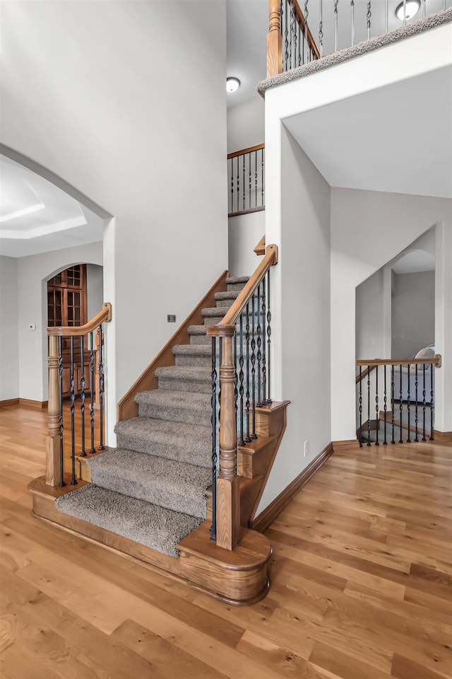 10149 Edward St, La Vista, NE 68128 - stairway with wood finished floors and a towering ceiling
