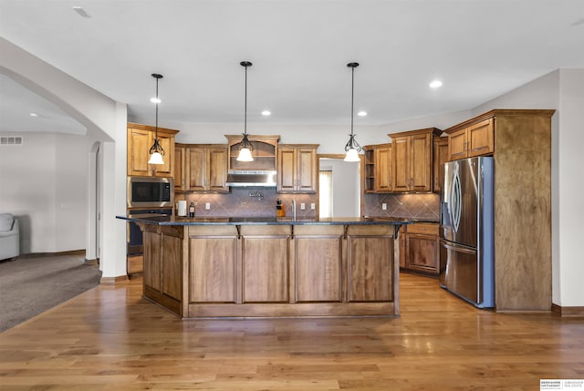 10149 Edward St, La Vista, NE 68128 - kitchen featuring stainless steel appliances, dark countertops, arched walkways, open shelves, and recessed lighting