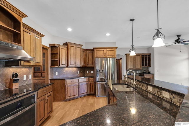 10149 Edward St, La Vista, NE 68128 - kitchen featuring open shelves, appliances with stainless steel finishes, under cabinet range hood, brown cabinetry, and recessed lighting