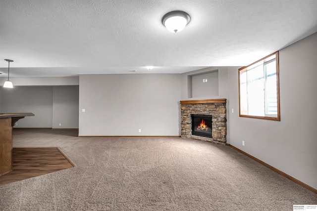 10149 Edward St, La Vista, NE 68128 - unfurnished living room with a fireplace, carpet flooring, and a textured ceiling