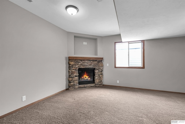 10149 Edward St, La Vista, NE 68128 - unfurnished living room with a stone fireplace and carpet flooring