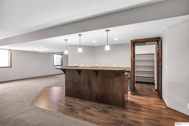 10149 Edward St, La Vista, NE 68128 - indoor bar featuring decorative light fixtures, recessed lighting, dark wood-style floors, and dark colored carpet