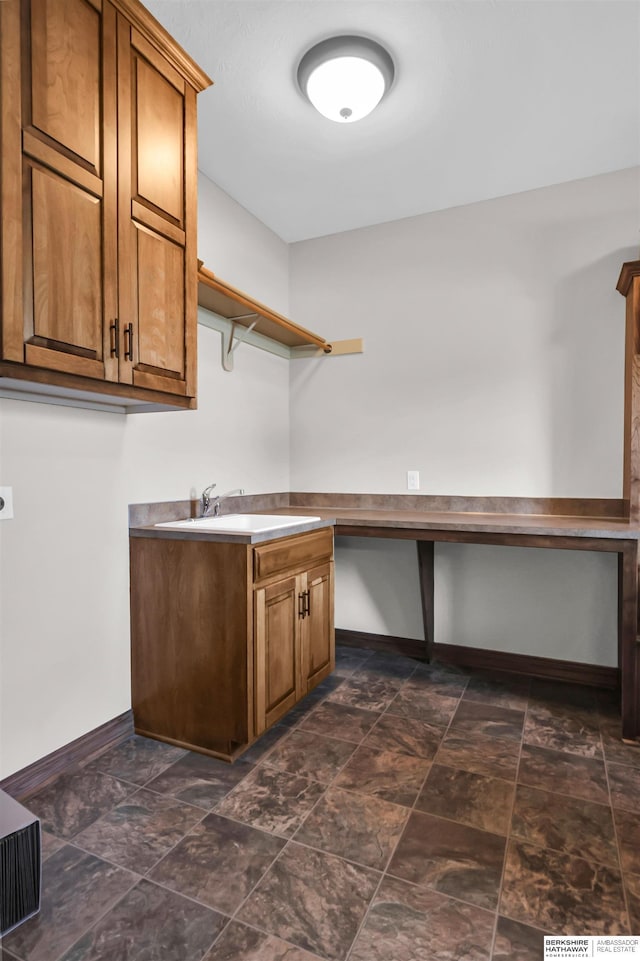 10149 Edward St, La Vista, NE 68128 - laundry area featuring dark stone finish floors