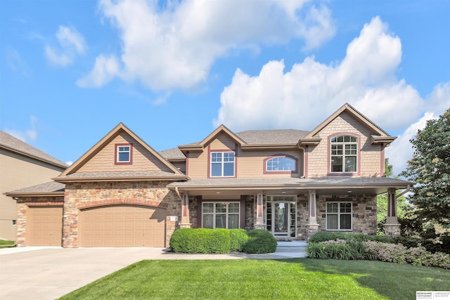 10149 Edward St, La Vista, NE 68128 - craftsman-style house featuring a front yard, concrete driveway, a garage, a porch, and stone siding
