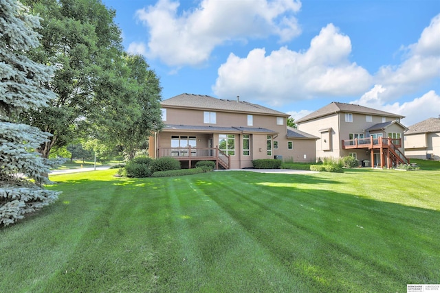 10149 Edward St, La Vista, NE 68128 - back of property featuring stairs, a deck, and a lawn
