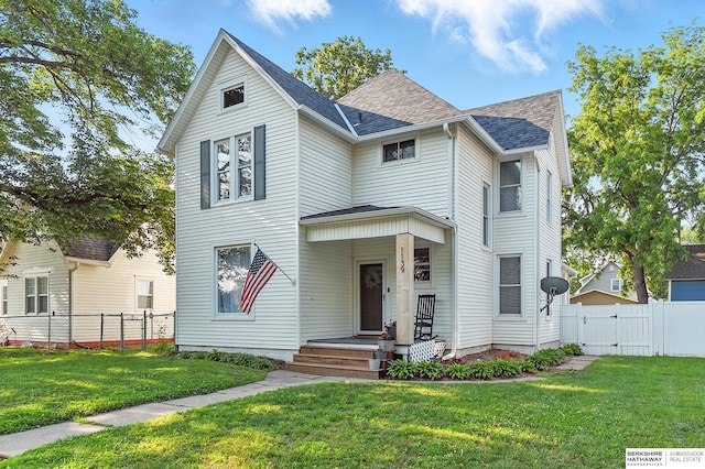 1139 E 5th St, Fremont, NE 68025 - view of front facade featuring a gate and a shingled roof