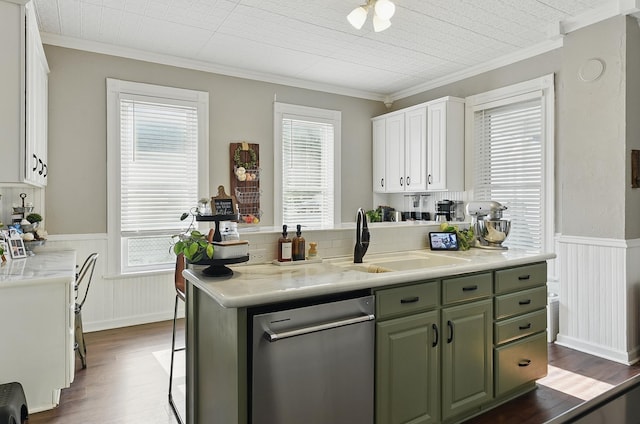 1139 E 5th St, Fremont, NE 68025 - kitchen with crown molding, dark wood-type flooring, a wainscoted wall, light countertops, and dishwasher