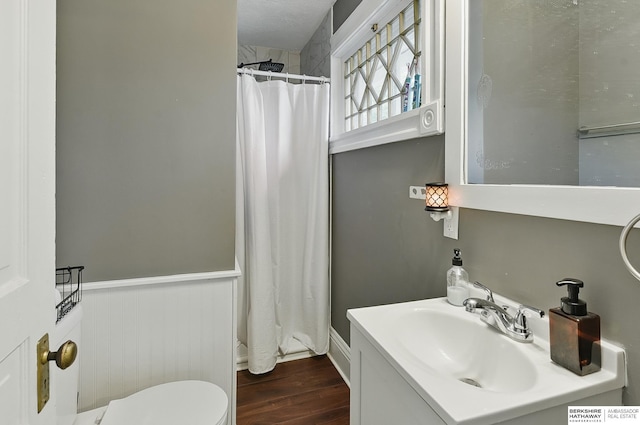 1139 E 5th St, Fremont, NE 68025 - bathroom with wood finished floors, vanity, and a shower with shower curtain