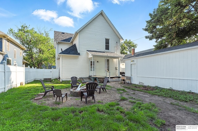 1139 E 5th St, Fremont, NE 68025 - back of house featuring an outdoor fire pit and a shingled roof
