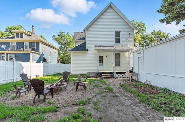 1139 E 5th St, Fremont, NE 68025 - back of property featuring a fire pit and roof with shingles