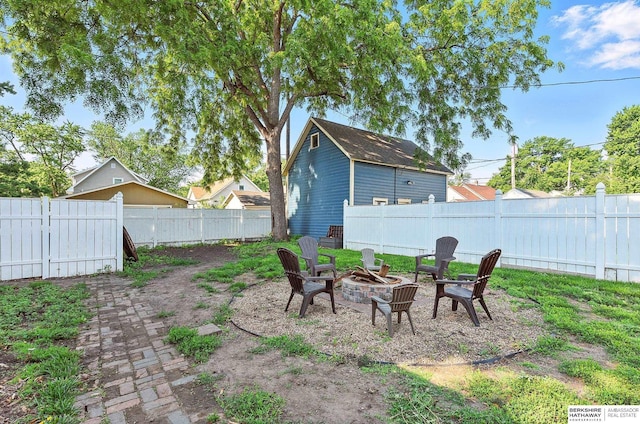 1139 E 5th St, Fremont, NE 68025 - fenced backyard featuring a fire pit