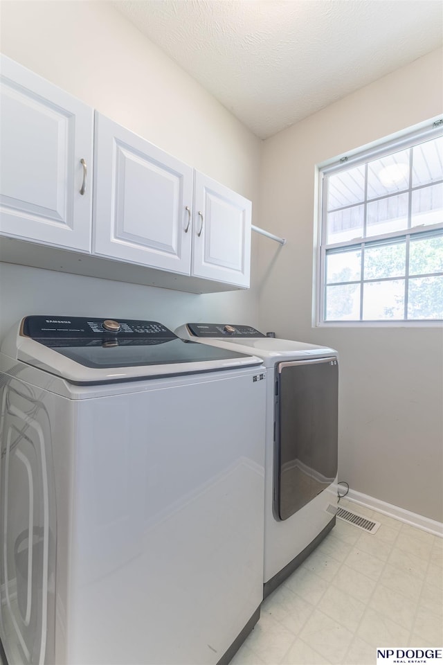 11351 S 198th St, Gretna, NE 68028 - washroom with washer and clothes dryer, cabinet space, and light flooring