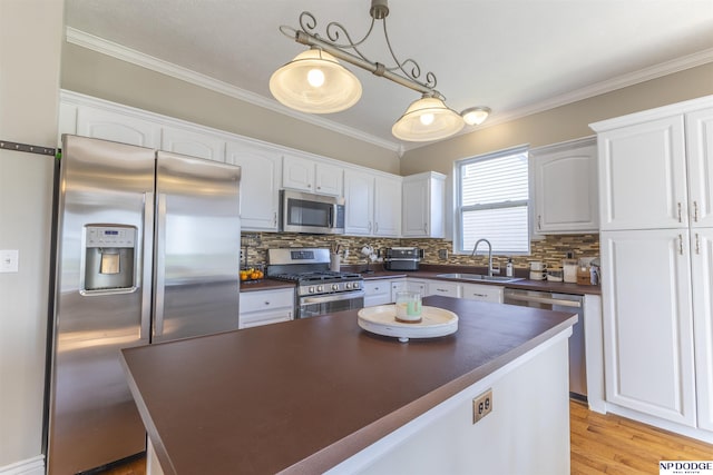 11351 S 198th St, Gretna, NE 68028 - kitchen featuring stainless steel appliances, dark countertops, crown molding, and white cabinets