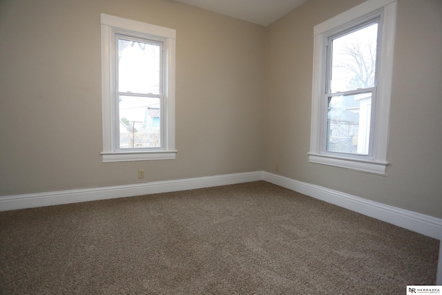 809 S 36th St, Omaha, NE 68105 - empty room with carpet flooring and baseboards