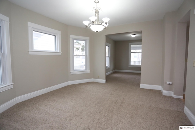 809 S 36th St, Omaha, NE 68105 - carpeted spare room with a chandelier and baseboards