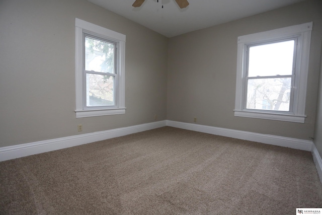 809 S 36th St, Omaha, NE 68105 - carpeted spare room featuring a ceiling fan and baseboards