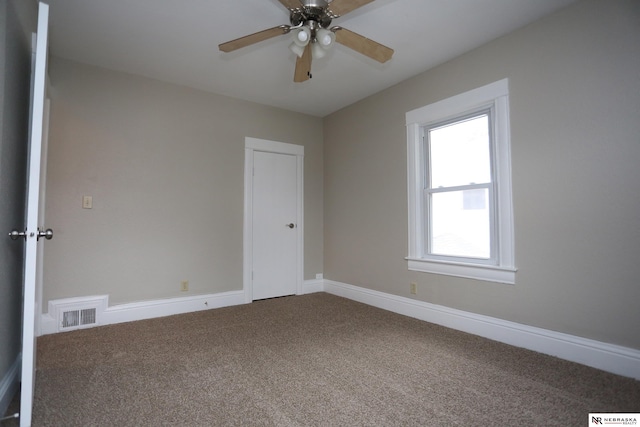 809 S 36th St, Omaha, NE 68105 - unfurnished room featuring carpet flooring and ceiling fan
