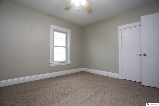 809 S 36th St, Omaha, NE 68105 - unfurnished bedroom featuring carpet flooring, ceiling fan, and a closet