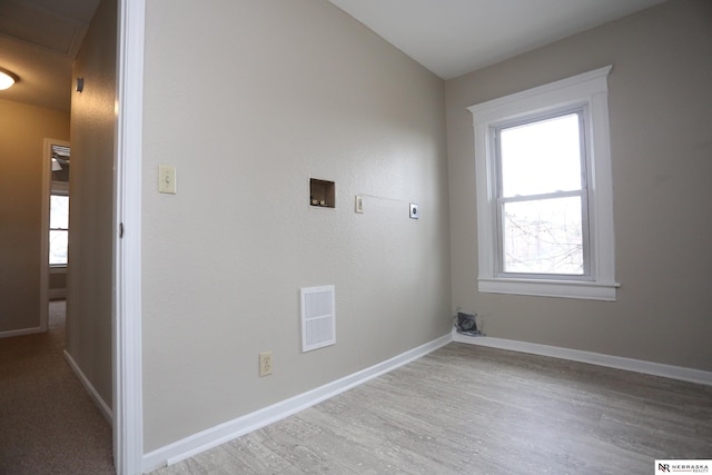 809 S 36th St, Omaha, NE 68105 - washroom featuring electric dryer hookup, hookup for a washing machine, and wood finished floors