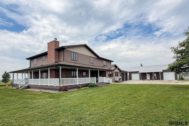 2035 355th Ave, Farragut, IA 51639 - back of property featuring covered porch, concrete driveway, a chimney, a garage, and a lawn