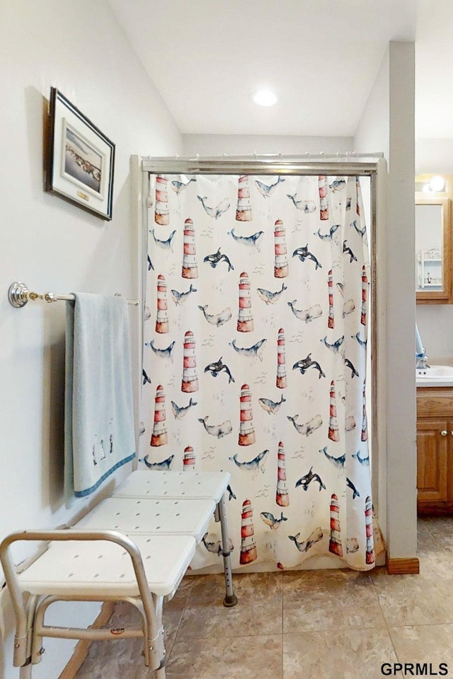 2035 355th Ave, Farragut, IA 51639 - bathroom featuring a shower stall, vanity, and recessed lighting