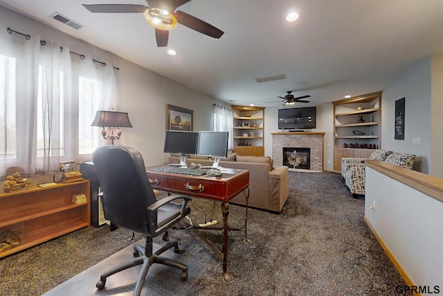 2035 355th Ave, Farragut, IA 51639 - carpeted office featuring a ceiling fan, a glass covered fireplace, built in shelves, and recessed lighting