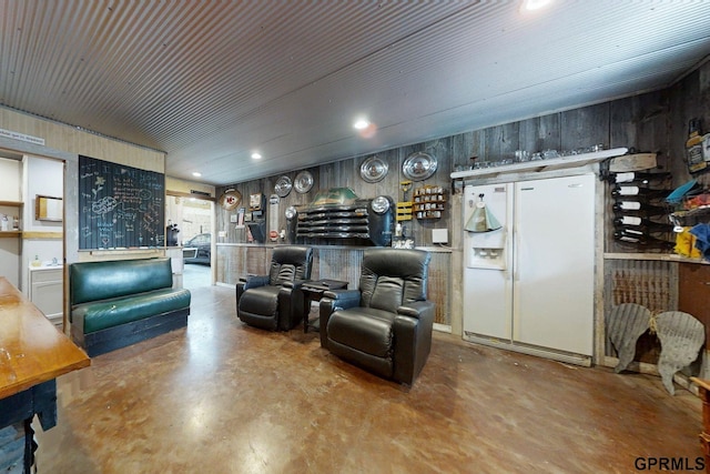 2035 355th Ave, Farragut, IA 51639 - living area featuring finished concrete floors, recessed lighting, and wood walls