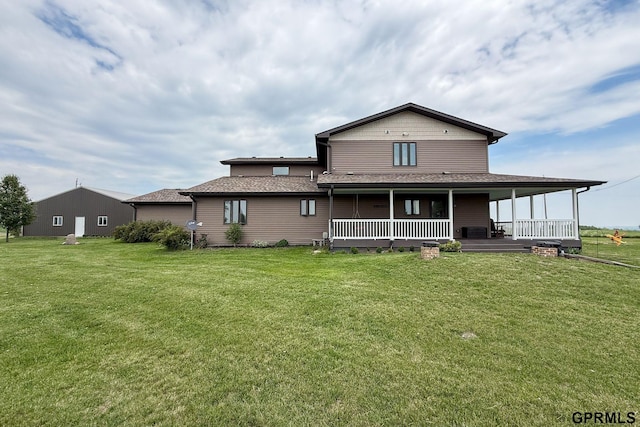 2035 355th Ave, Farragut, IA 51639 - back of house featuring a yard, covered porch, and roof with shingles