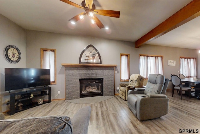 2035 355th Ave, Farragut, IA 51639 - living room with wood finished floors, ceiling fan, a fireplace, and beam ceiling