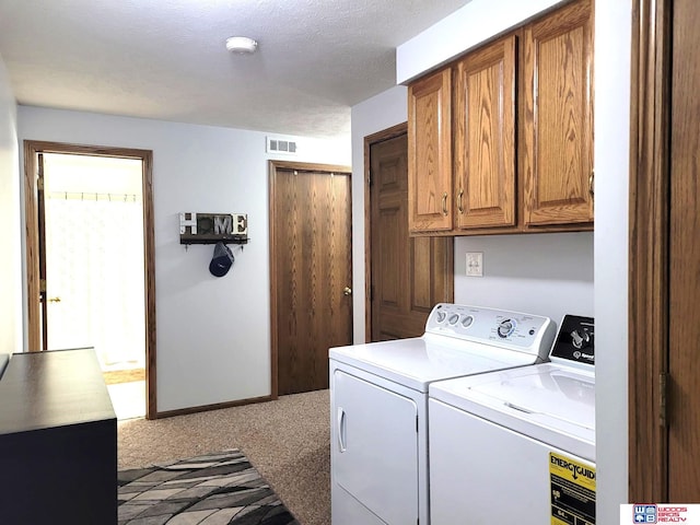 1177 N Columbia Ave, Seward, NE 68434 - laundry room featuring cabinet space, independent washer and dryer, and carpet floors
