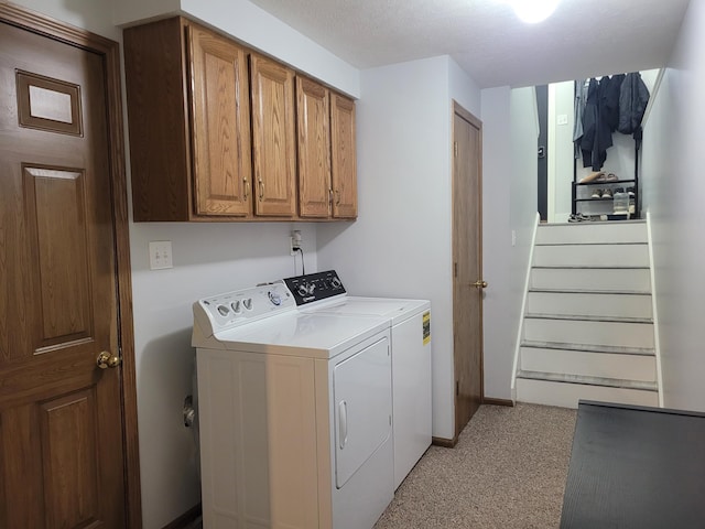 1177 N Columbia Ave, Seward, NE 68434 - laundry area featuring independent washer and dryer, light carpet, and cabinet space