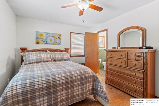 8832 Spaulding Cir, Omaha, NE 68134 - bedroom with light wood finished floors, a ceiling fan, and ensuite bathroom