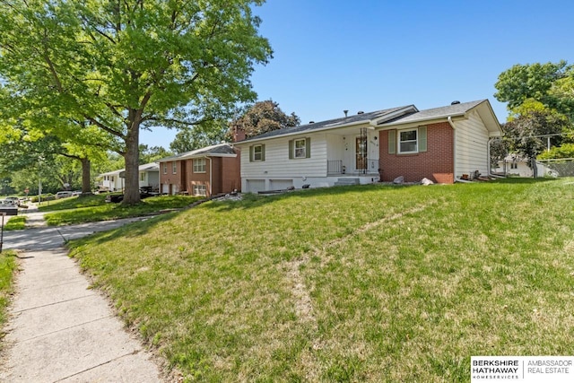 8832 Spaulding Cir, Omaha, NE 68134 - single story home with brick siding, a front lawn, and a garage