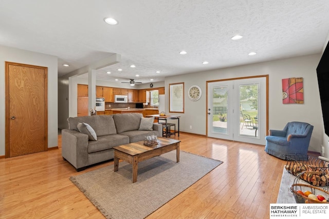 8832 Spaulding Cir, Omaha, NE 68134 - living area with recessed lighting, light wood-style flooring, and a ceiling fan